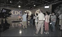 A group of communicators watching the filming of a public service announcement.