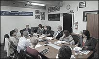 A group of public health professionals at a meeting of various CDC partners.