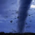 Photo of tornado on the ground with debris.