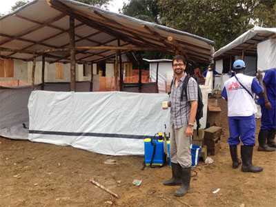 Jose standing outside the treatment center in Rivercess County, Liberia.