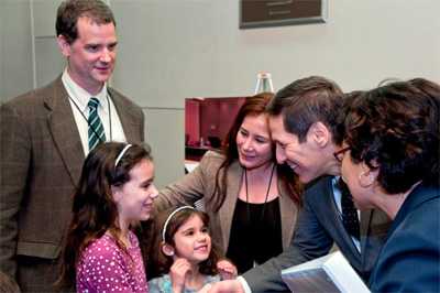 Fred and Fatima with their two daughters as they meet CDC Director, Dr. Tom Frieden.