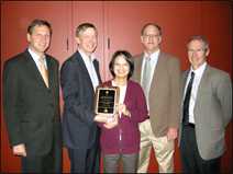 CDC researcher Dr. Claire Huang (center) receiving CO-LABS High Impact Research Award from Colorado Governor John Hickenlooper in November 2011