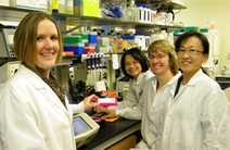 Dr. Claire Huang (center) and her team