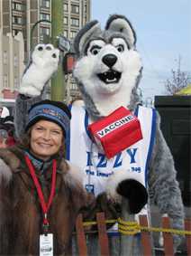 Each year, the State of Alaska's Immunization Program teams up with the Iditarod to promote vaccination. This is Iditarod mascot Izzy with Senator Lisa Murkowski at the start of the race. Photo courtesy Doreen Stangel, State of Alaska Immunization Program.