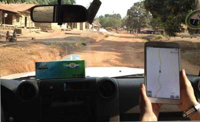 CDC responders Yoshinori Nakazawa and Jessica Hancock Allen used OpenStreetMap data on a tablet computer to help navigate to this small village between Kambia town and Kabaia in Kambia District, Sierra Leone.