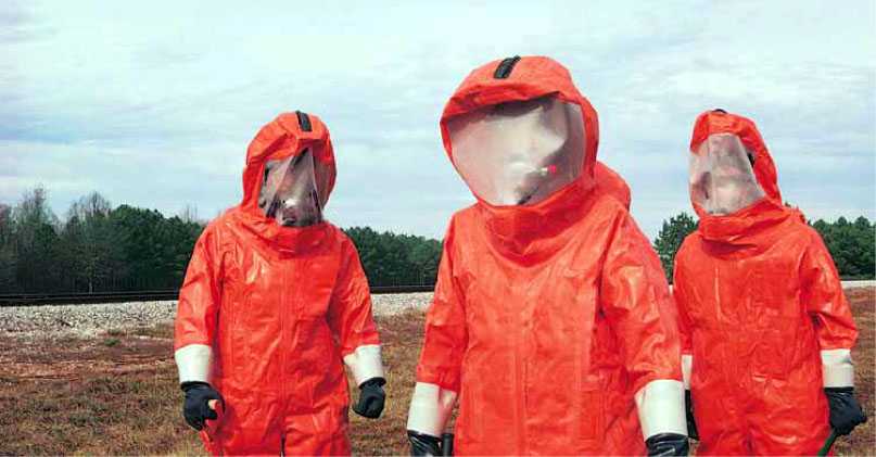 Photograph of emergency responders in hazardous materials protective suits