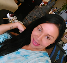 Screen shot image from a video created by Let’s Stop HIV Together campaign participant Maria. Image shows Maria sitting in a chair in a casual living space.