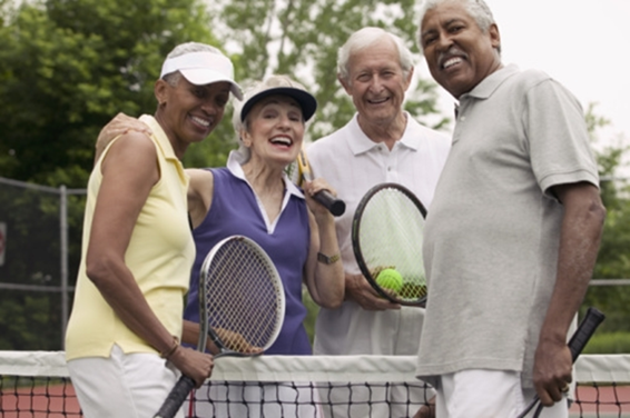 four people playing tennis