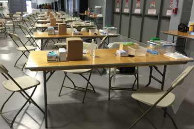 	Image shows tables set up at one university to swab students participating in a carriage survey for Neisseria meningitidis.
