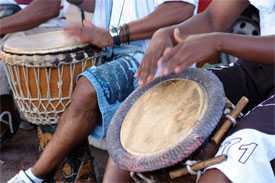 group of people playing natural hide drums 
