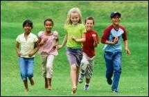 Photo of children running in a field
