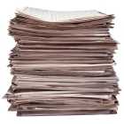 Photo of stacked newspapers