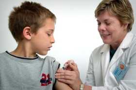 Photo of a boy getting vaccinated against HPV