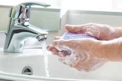 Photo of a person washing hands