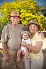 Photo of grandparents holding a baby