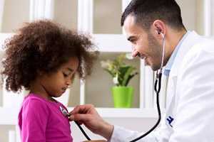 a little girl with a doctor