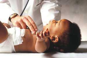 a doctor examining a baby