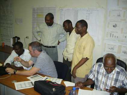 CDC’s Ezra Barzilay (second from left), working with country partners to set up a nationwide database that will help track cholera cases