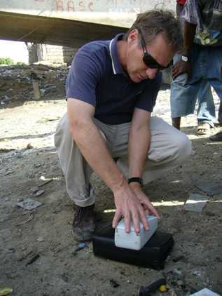 CDC’s Tom Handzel collecting water samples for testing to see if household water contains chlorine