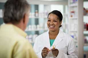 Pharmacist talking to a patient about their medication.