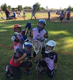 young people outside at lacrosse tournament
