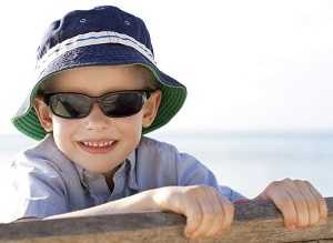 boy wearing hat and sunglasses