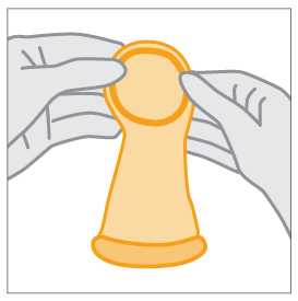 Hands holding female condom at the thick, inner ring.