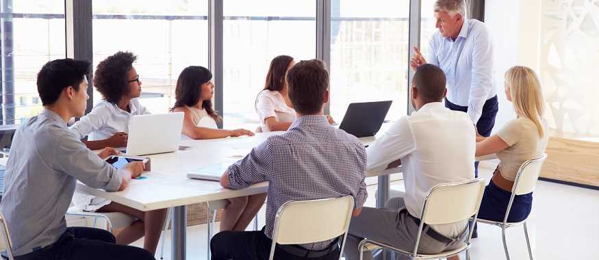 people meeting at table in conference room
