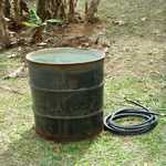 standing water in an oil barrel