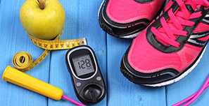 Image of an apple. tape measure, jump rope, pink sneakers and a blood sugar tester