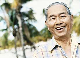 	older Asian man smiling