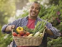 A man holding a basket of vegetables