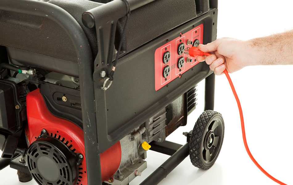 person plugging an extension cord into a portable generator