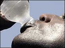 Photo of athlete drinking water.