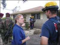 Photo of emergency workers talking with each other.