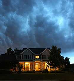 Photo of cloudy sky over a house