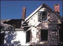 Photo of burnt house.