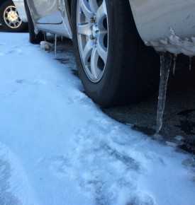	Car on Road with Icicles Forming on Bumper