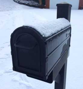 	Curbside Mailbox with Melting Snow on Its Top