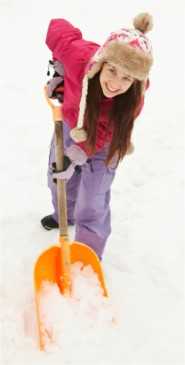	Young Woman Shoveling Snow