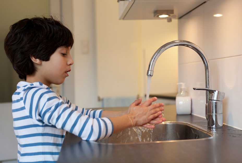 Boy washing hands
