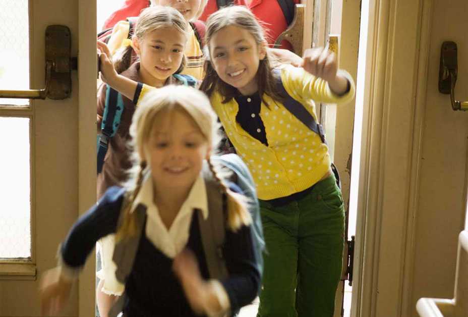 Kids running into school