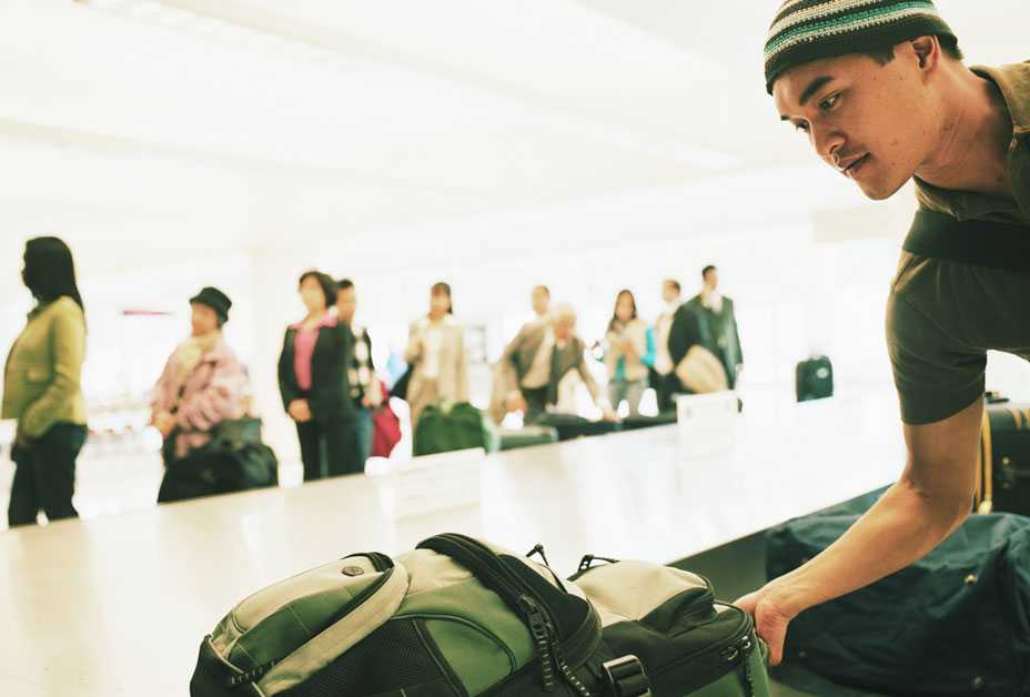 Man getting bag at airport
