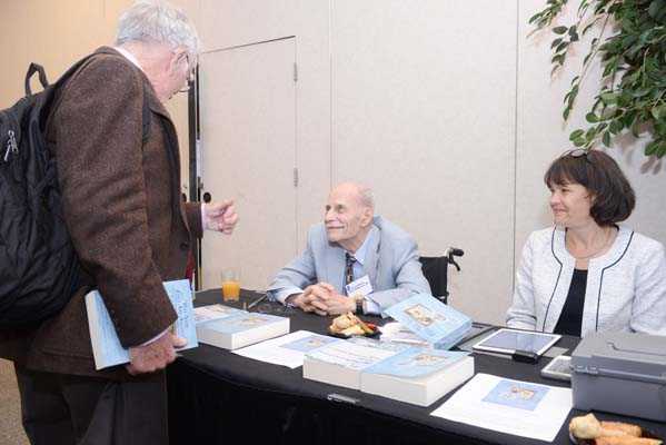 Book signings by EIS alum, Eugene Gangarosa (EIS 1964) at EIS Alumni Association booth