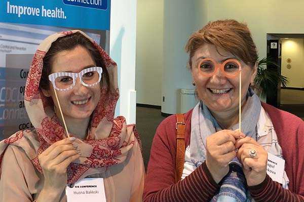 CDC Learning Connection photo booth fun with conference attendees