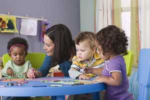 Childcare worker with three kids