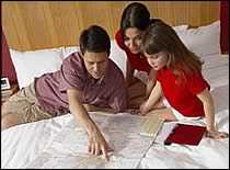 Photo of family going over plans.