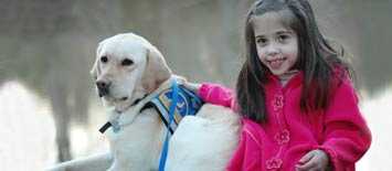 Photo: A girl with her service dog