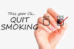 Hand checking yes next to text that says this year I'll quit smoking