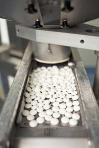 Photo: Pills on assembly line